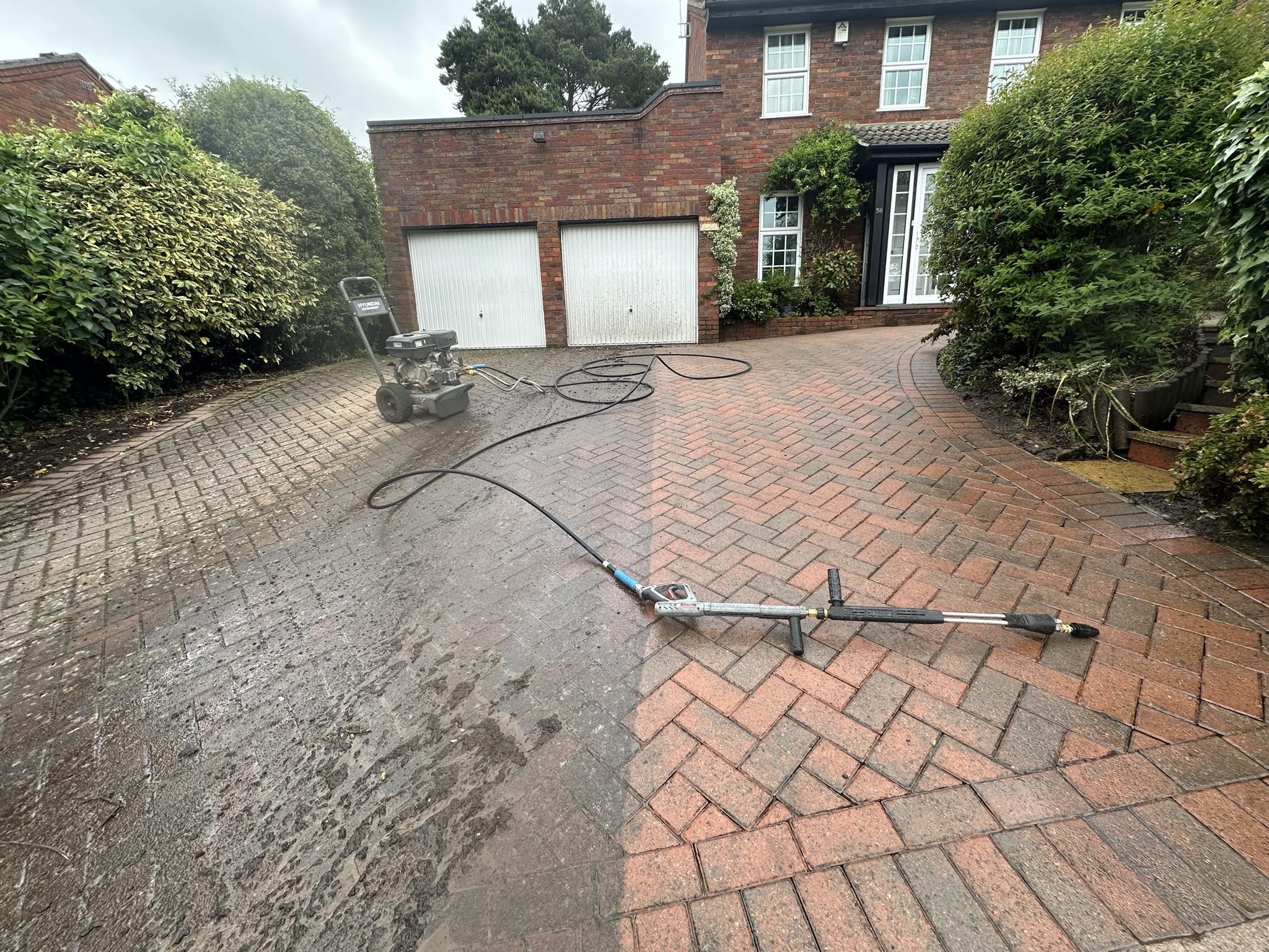 Professional pressure washing on UK driveway